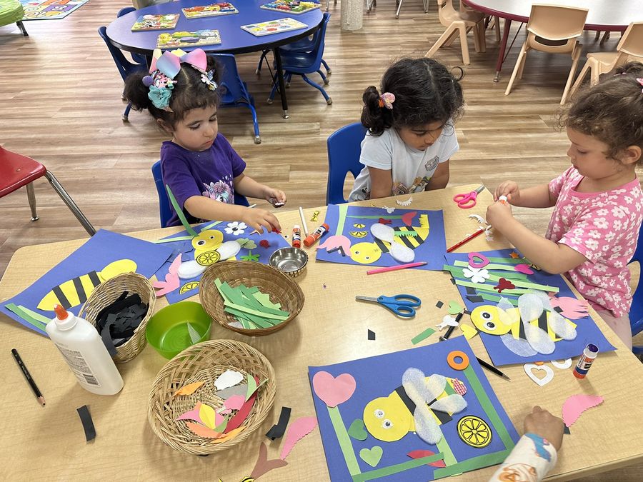 Children making bee crafts at Butterflies Academy