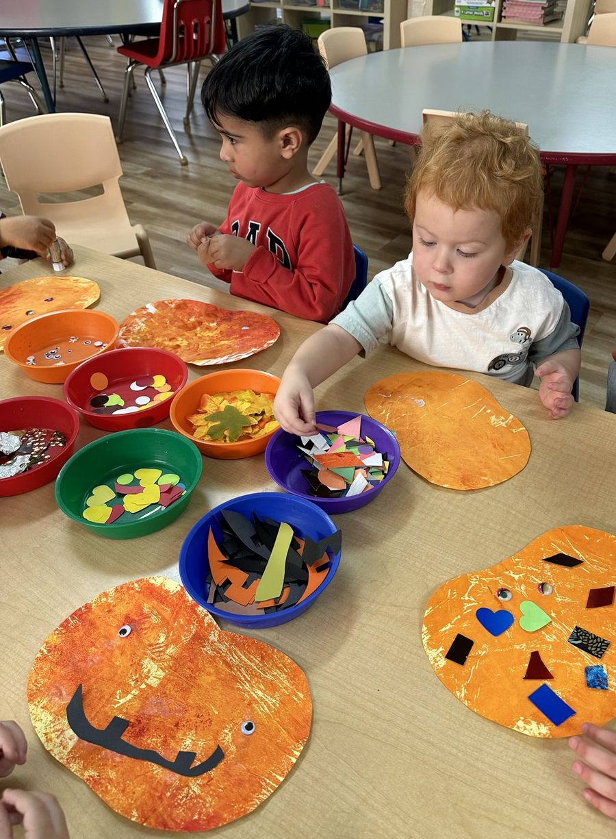Children decorating pumpkin crafts at Butterflies Academy