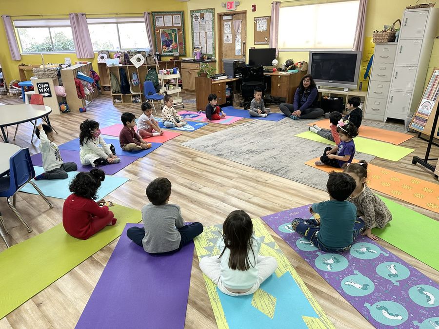 Children in a yoga class at Butterflies Academy